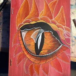 Dragon Eye Book Box. Lined with cork for dice storage and throwing or a soft landing for your treasures. Dragon Eye Book Box. Lined with cork for dice storage and throwing or a soft landing for your treasures.